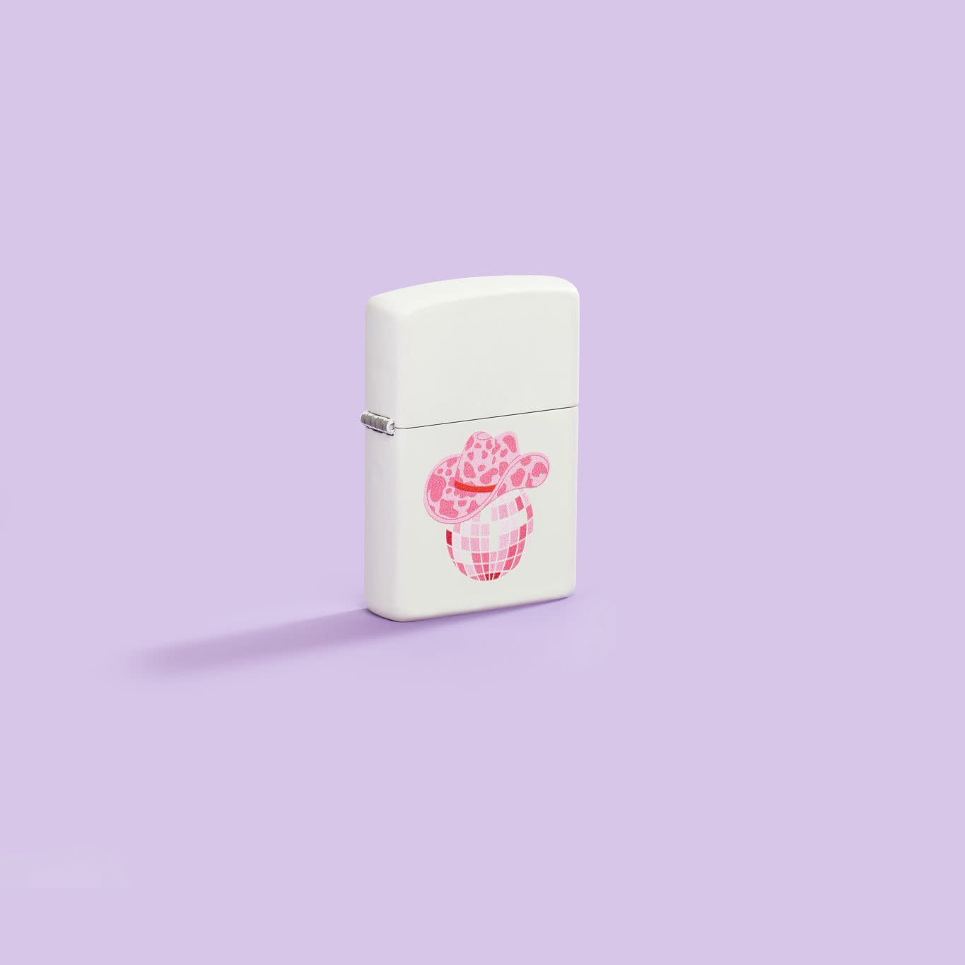 Lifestyle image of Zippo Honky Tonk Design White Matte Windproof Lighter standing in a purple scene.